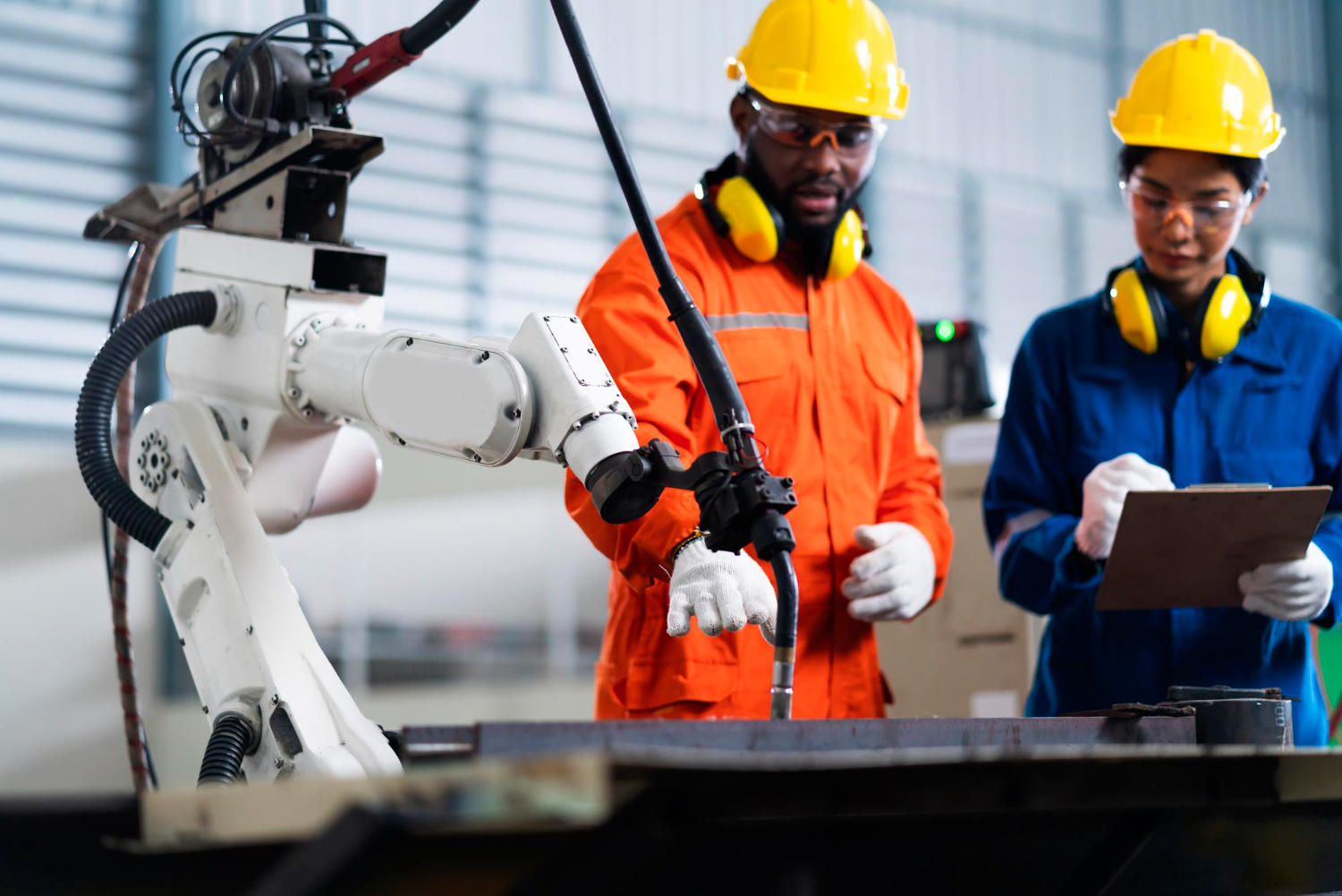 Male and female technician with a control relay